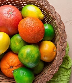 Assortment, citrus fruits, in a basket, close-up, top view, no people