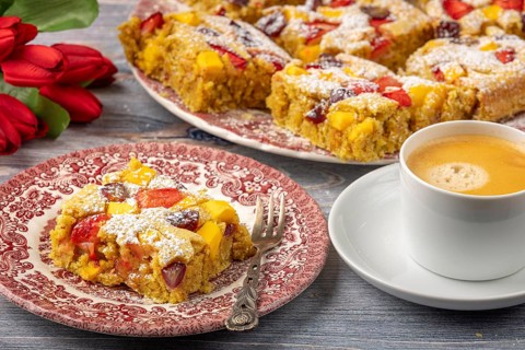 Plate of fruit cake served with coffee
