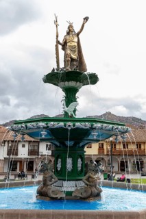 King of the Incas Pachacutec over fountain in Plaza de Armas, Cusco, Peru