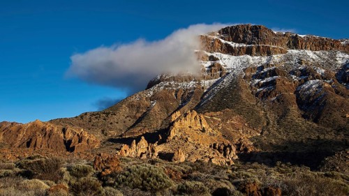 Near Ermita de las Nieves, snowy mountain with clouds in clear blue sky, Teide, Parque Nacional del