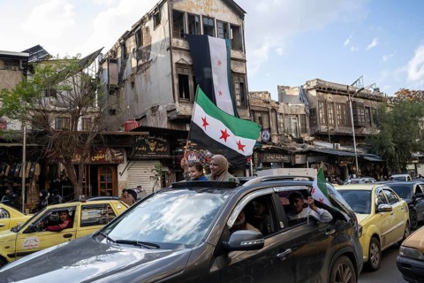 Damascus, Syria. December 7th 2025. Syrians waving flags and celebrating one year since the fall of