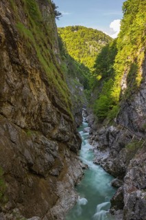 The Lammer creek is flowing fast through the Lammerklamm on a sunny hiking day