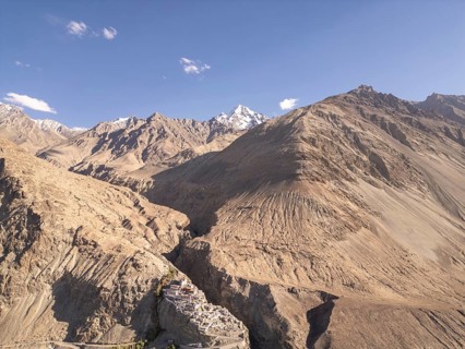 A stunning view of a remote monastery nestled within the rugged mountains of Diskit Gompa, Nubra