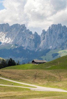 Spring view of the serene landscape in Jaun, located in the Gruyere district, Switzerland. A wooden