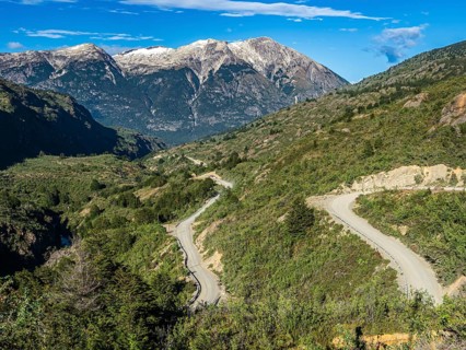 Road Carretera Austral south of Cochrane, mountain pass, driving bus, Patagonia, Chile