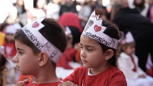 Children celebrate the 102nd anniversary of the Republic Day of Turkey, a national holiday