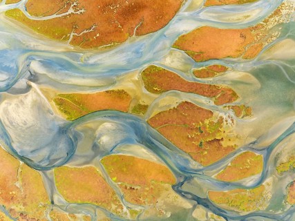 Streams at low tide in the marshland of the Walvis Bay lagoon. Aerial view. Drone shot. Walvis Bay,