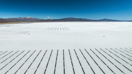 Expansive view of Salinas Grandes in Salta, Argentina. The white salt flats stretch towards the