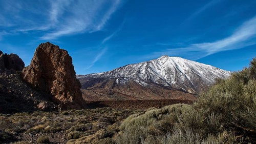Roques de Garcia, snow-capped mountains with blue sky in the background, Teide National Park, Teide