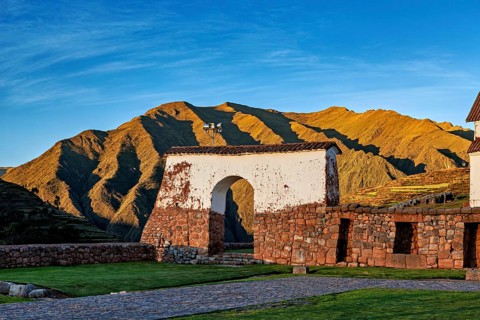 Ruins in front of a mountainous landscape in the soft light of sunrise, the historic village of