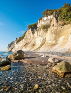 Beach with boulders at the chalk cliffs of Møns Klint on the Baltic Sea, Møn Island, Denmark