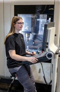 Oberhausen, North Rhine-Westphalia, Germany, Trainee woman in metalworking. Trainee cutting machine