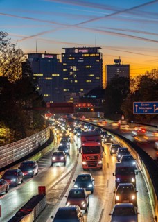 Evening traffic, partly with traffic jams, slow-moving traffic on the A40 motorway, Essen skyline,