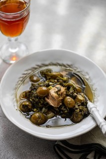 Traditional Georgian dish Chakapuli features tender lamb cooked with tarragon, coriander, green