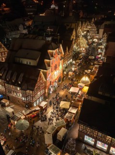 Aerial view of a lively Christmas market with many lights and visitors, Christmas market Calw,