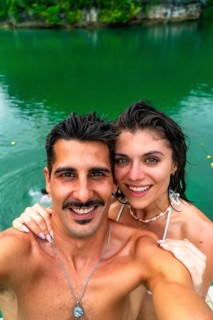 Tourists enjoying island hopping and swimming in the beautiful turquoise waters of sugba lagoon,