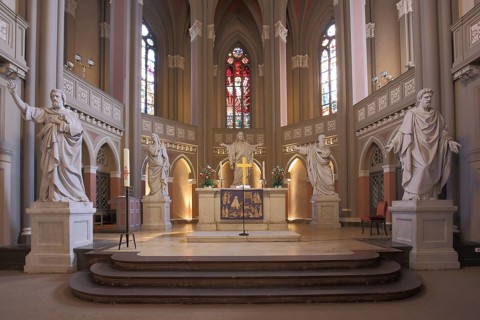 Altar room with four evangelists and Jesus sculptures, apostle statues on pedestal, market church,
