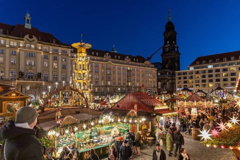 Large pyramid at the Striezelmarkt Christmas market on the Altmarkt in Dresden, in the background