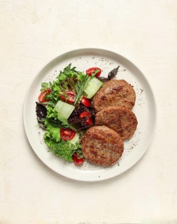 Fried cutlets, minced beef, with vegetable salad, top view, no people