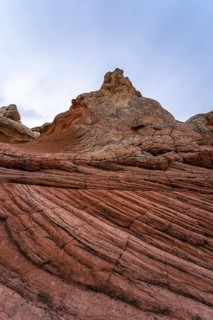 A dynamic view of the unique, striated rock formations in White Pocket, Arizona, capturing the