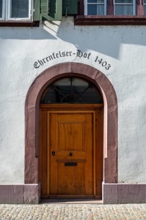 Classic wooden door with sandstone arch with the inscription Ehrenfelser Hof 1403 in the old town
