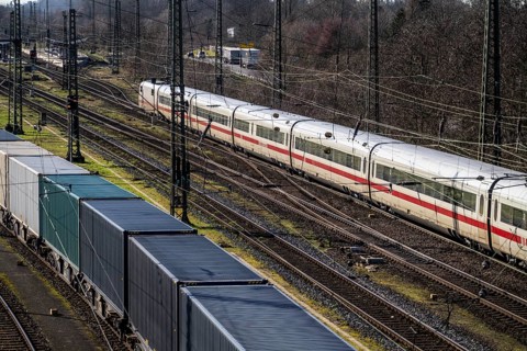 ICE long-distance train, on the line, container trains in the freight yard, so-called installation