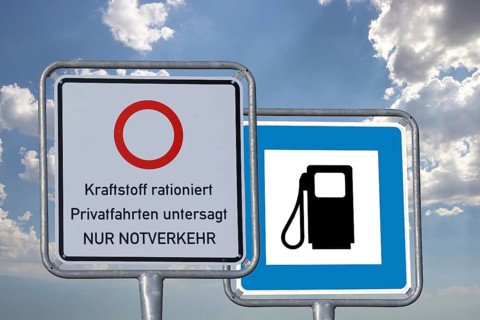 (photo montage) Road sign with information about driving bans and a gas station road sign vacant