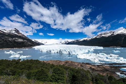 Perito Moreno glacier with glacier breakout edge, ice floes floating in Lake Argentino, surrounded