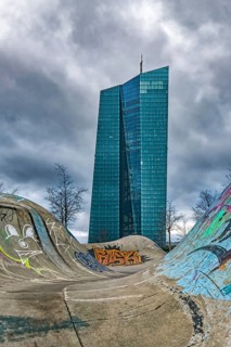 Skatepark in Osthafen, behind it European Central Bank (ECB) in front of dramatic clouds, Frankfurt