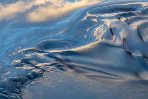 Waves in a stream, abstract, Norrbotten, Lapland, Sweden, August 2022