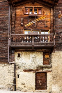 Old farmhouse with decorated wooden façade, historic town center, Grimentz, Val d'Anniviers, Valais