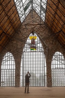 Rye, Colorado, A visitor photographs the Bishop Castle on a foggy morning. The Castle is an