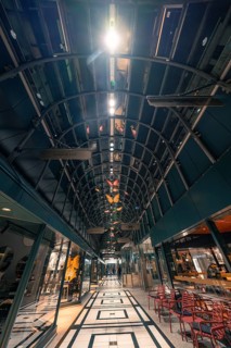 Interior view of a modern shopping centre with vaulted and illuminated ceiling, Calwer Tor,