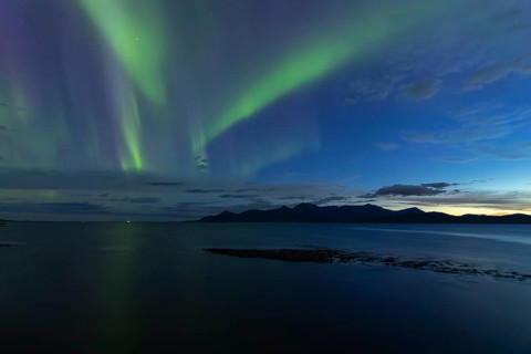 Northern lights at dawn over Sørfolda Fjord near Kjerringøy between Bodø and Sørfold in Norway
