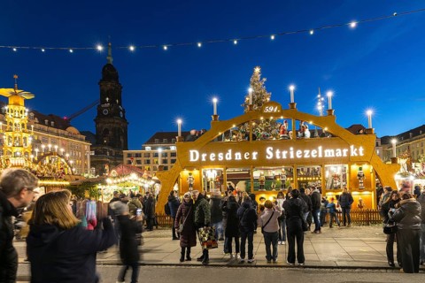 Large walk-in light arch at the entrance to Striezelmarkt, Germany's oldest Christmas market, with