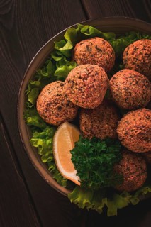 Chickpea falafel balls, on a wooden table, close-up, vegetarian food