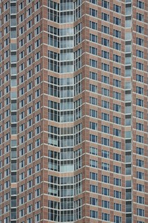 Detail of the exhibition tower, red pattern from window, modern building, high-rise building,