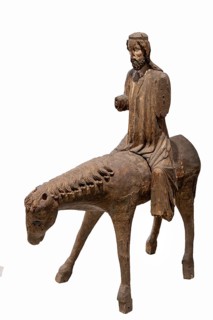 Palm tree donkey, wooden figure from around 1350, on a white background, Diocesan Museum,