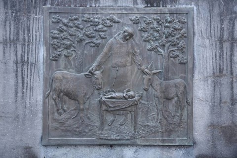 Relief depicting the biblical scene of the birth of Jesus with Joseph at the Saint Francis