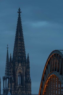 Cologne Cathedral and the Hohenzollern Bridge illuminated with LED lights, Cologne, North