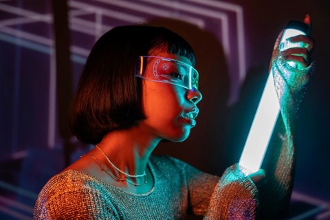 Latin woman immersed in a futuristic setting, wearing cutting-edge virtual reality glasses. The