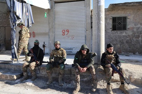 In Aleppo, Syria on January 10, 2026, Syrian Army soldiers deploy throughout the Sheikh Maqsoud and