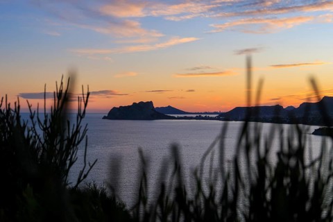 Captivating view of a Costa Blanca sunset over the Mediterranean Sea, with a serene seascape framed