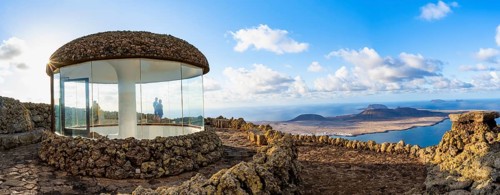 Stairway and viewing platform at the Mirador del Río viewpoint, in the evening light with sun
