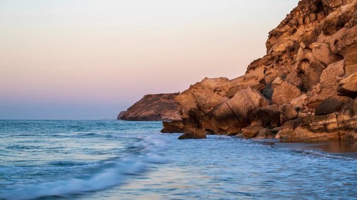 Sunrise on the coast near Mirbat, Oman