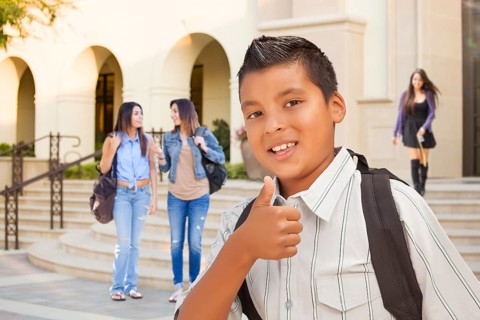 Young Male Hispanic Student Boy with Thumbs Up on Campus