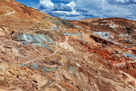 Extensive mining landscape with bare, colorful rocks under cloudy sky, The silver mines of Potosi