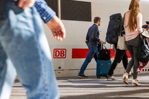 Stuttgart Central Station. Travelers on the platform. ICE with Deutsche Bahn AG logo. Stuttgart,