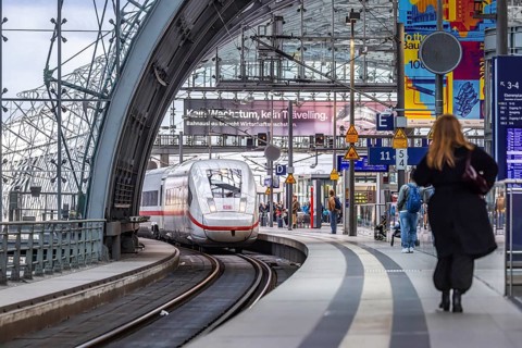 Berlin Central Station. Travelers on the platform. Incoming train. ICE. Berlin, Germany