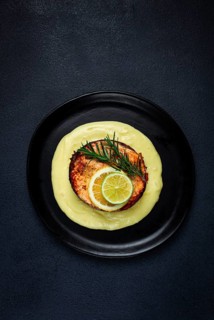 Salmon steak, fried, mashed potatoes, top view, rosemary, lemon and lime, homemade, one serving, no